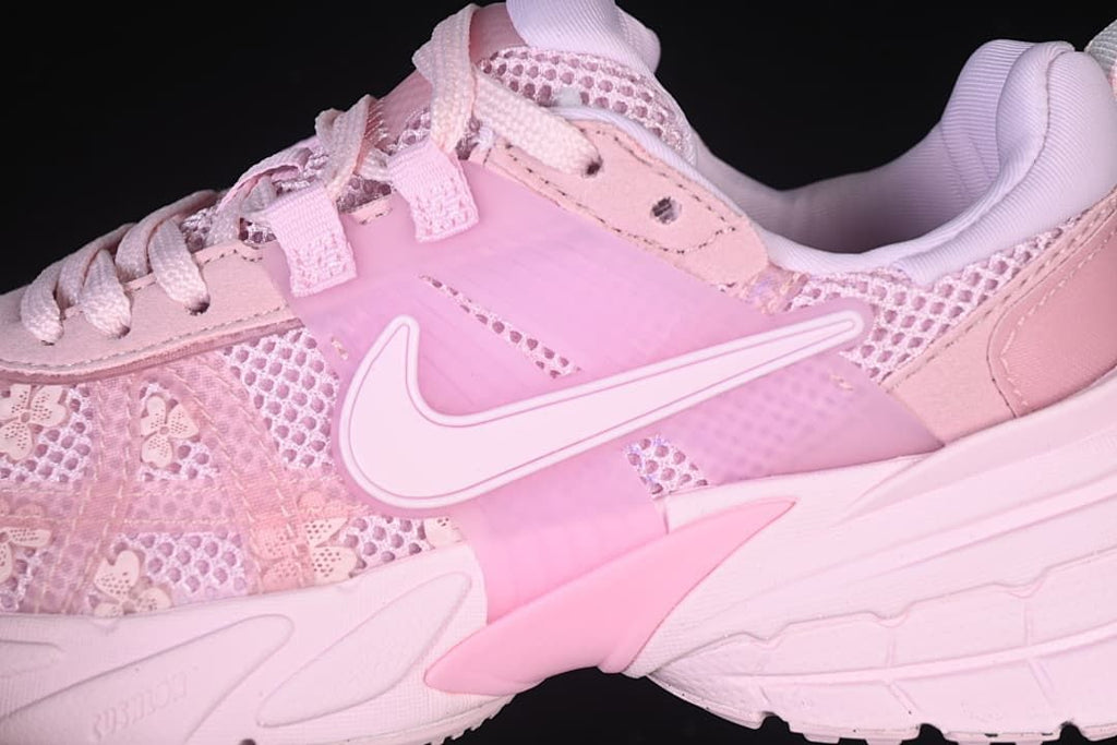 Close-up of the side Swoosh, floral-patterned mesh-look upper and sculpted midsole.