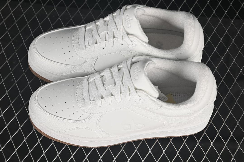 Pair of white low-top sneakers shown from above at an angle