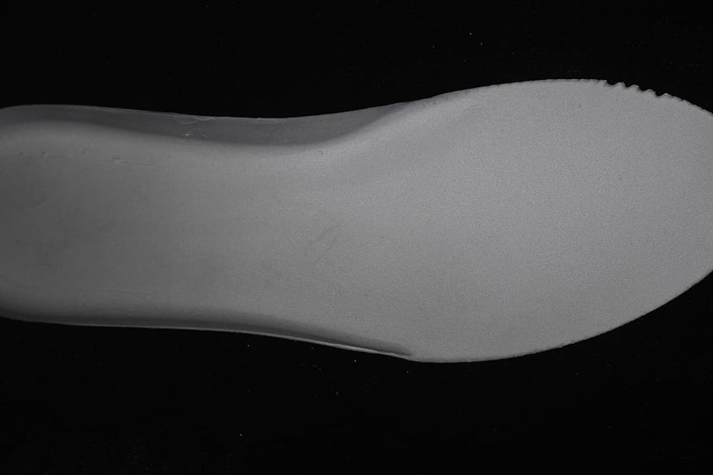 Close-up view of the sneaker's light-colored midsole