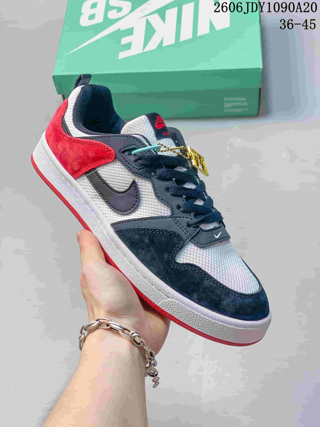 Angled side view of a black, white, and red Nike SB Alleyoop low-top sneaker