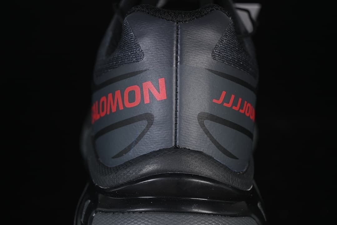 Rear view of the shoe with red Salomon and JJJJound lettering
