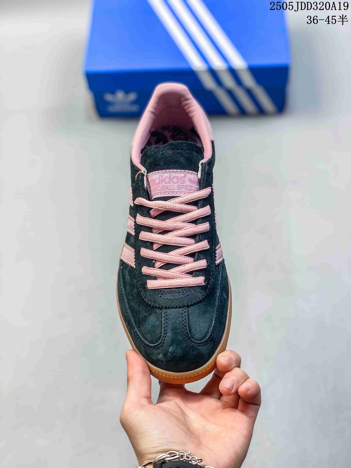 Top view of the sneaker with pink laces and dark upper