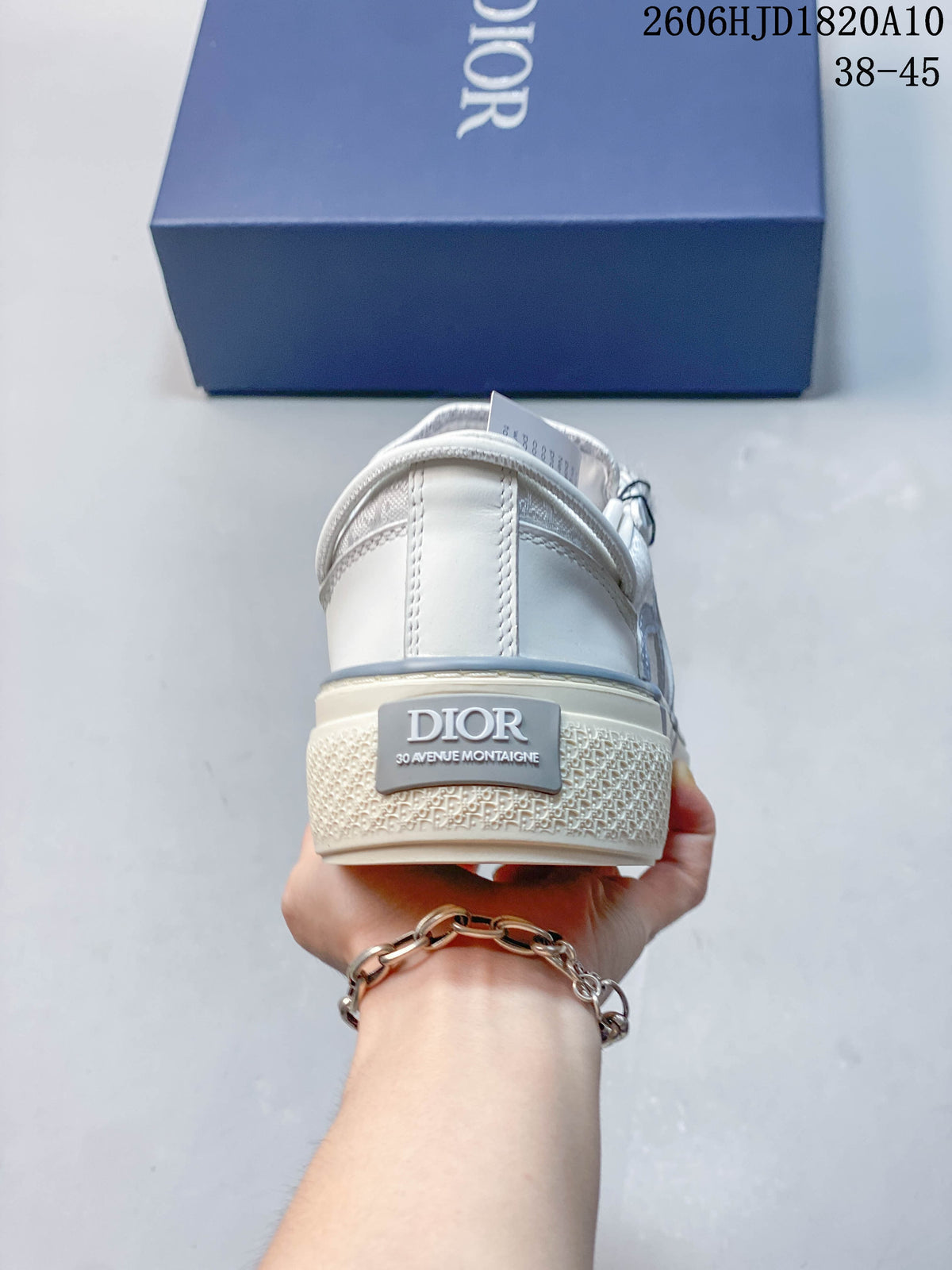 Rear view of a Dior B33 sneaker with a branded heel detail and textured sole