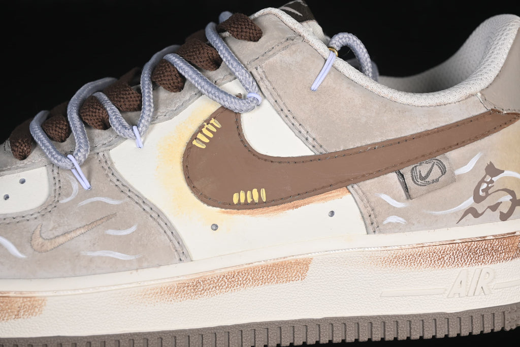 Close-up of brown side swoosh, pale panels, and horse illustration