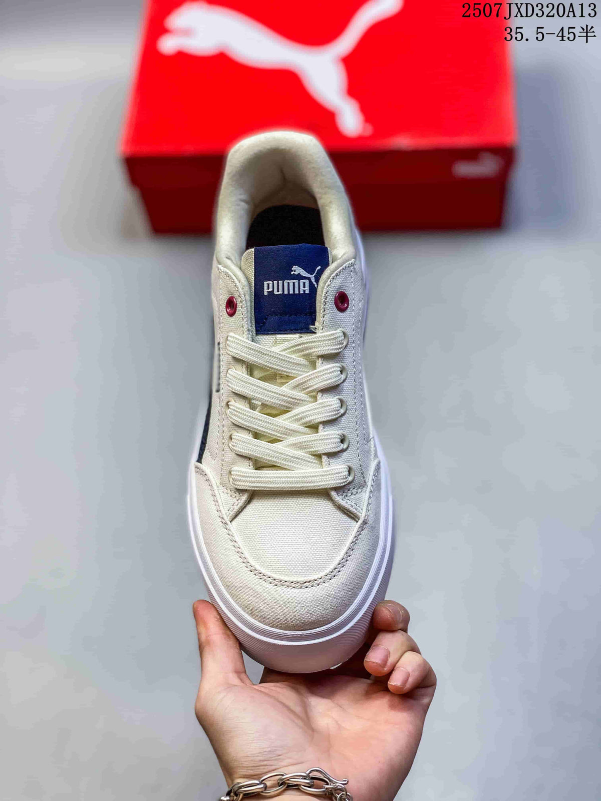 Top view showing cream laces, a navy tongue label and burgundy eyelets.