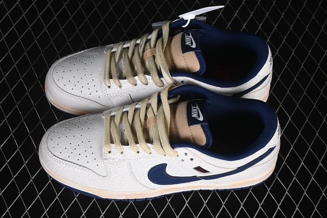 Pair of off-white and navy low-top sneakers shown from above