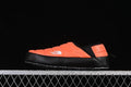 Side view of an orange and black The North Face Thermoball Traction Mule