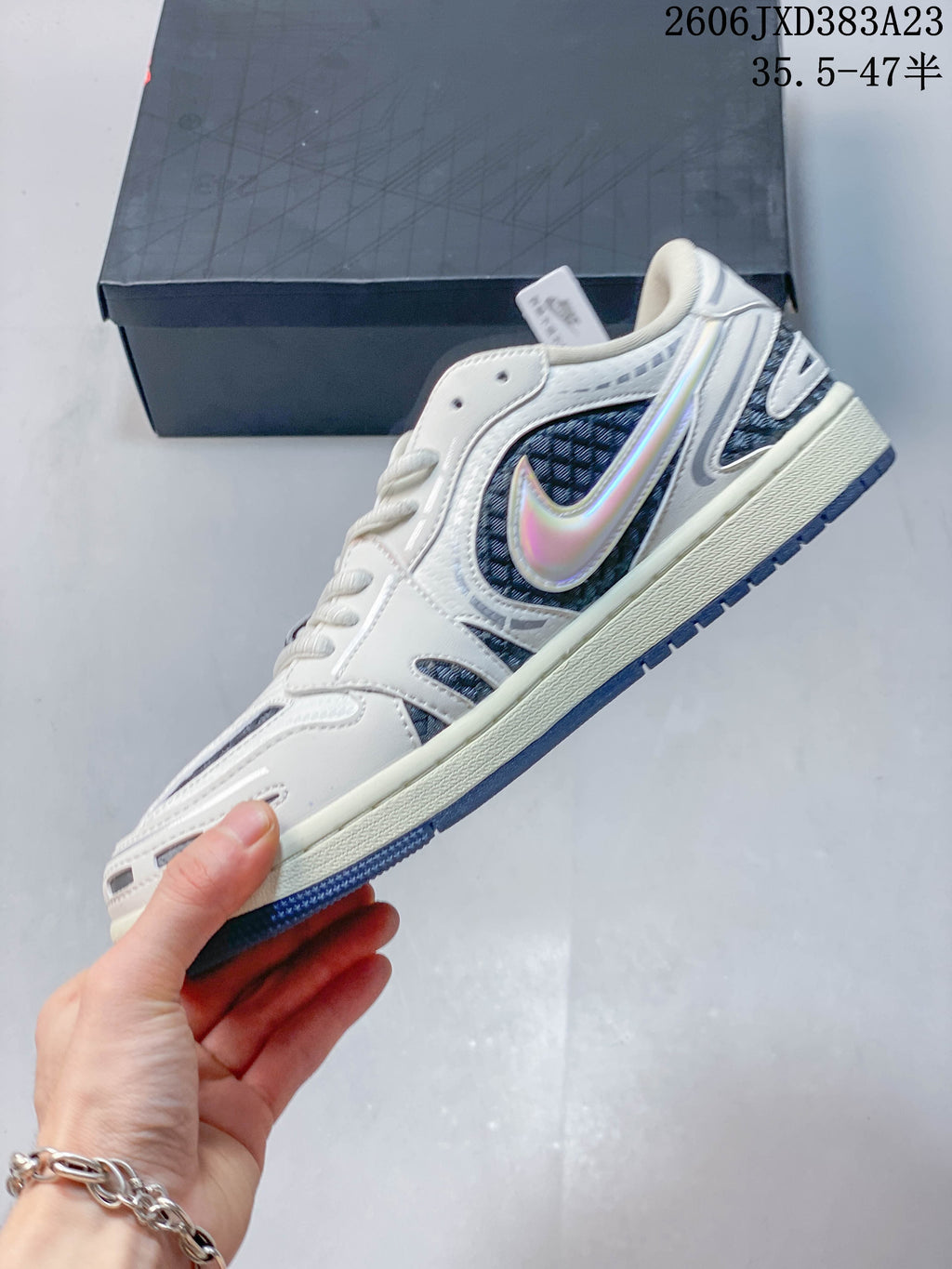 Side profile showing the iridescent Swoosh and patterned panels