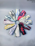 Several Onitsuka Tiger Mexico 66 Deluxe sneakers arranged in a circle in different colors