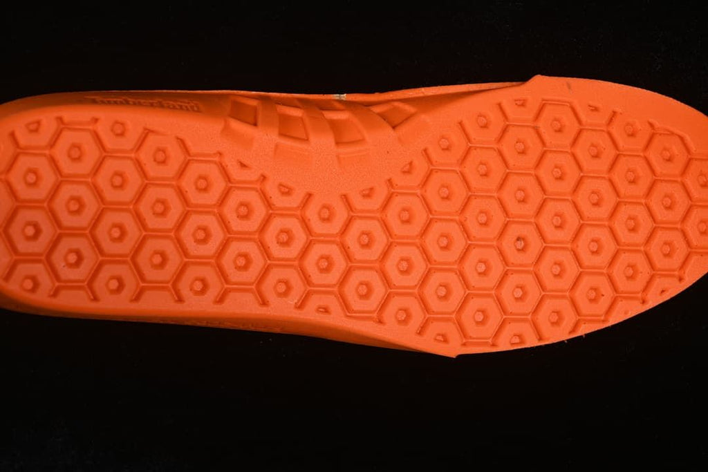 Close-up of the boot's orange footbed with a patterned surface