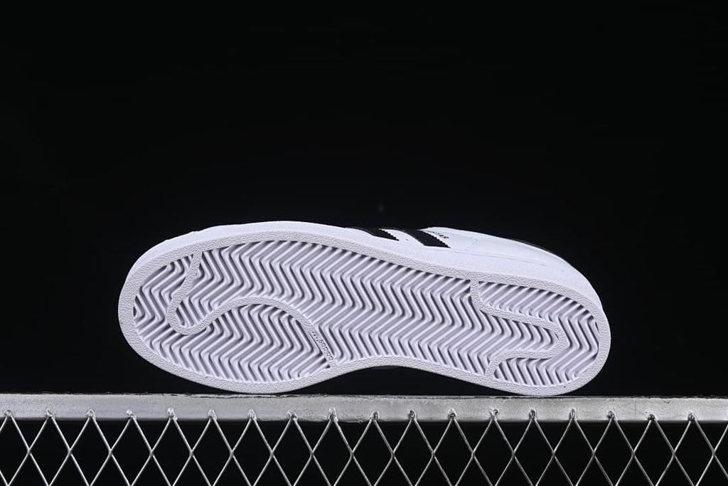 Underside of the sneaker showing a patterned white outsole