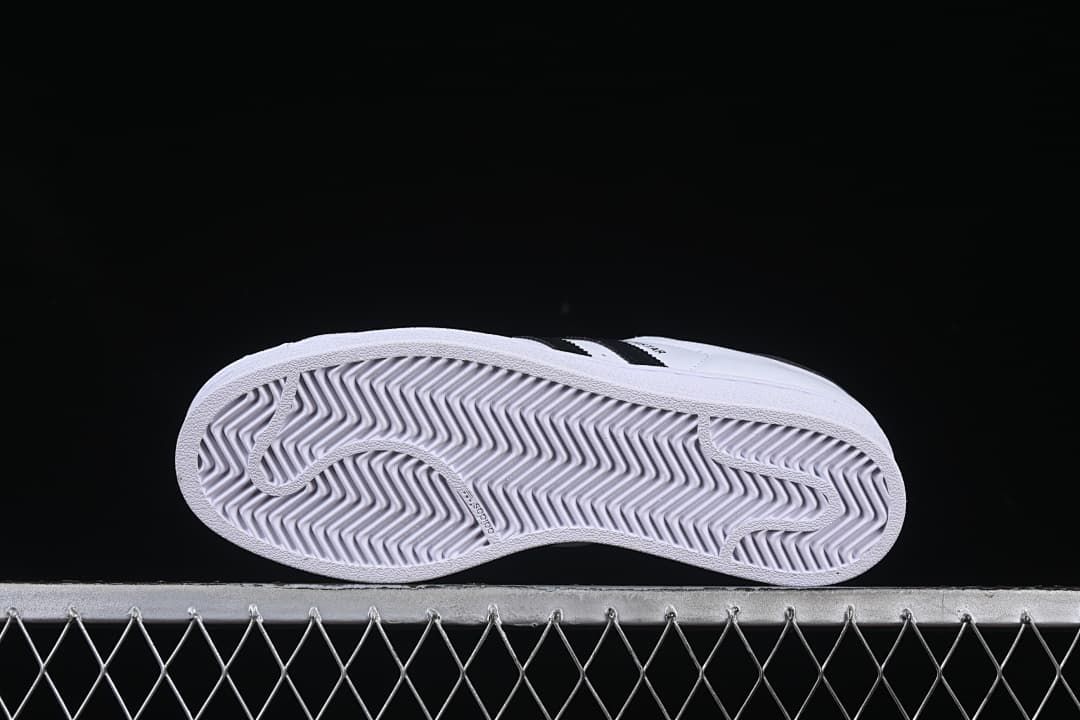 Underside of the sneaker showing a patterned white outsole