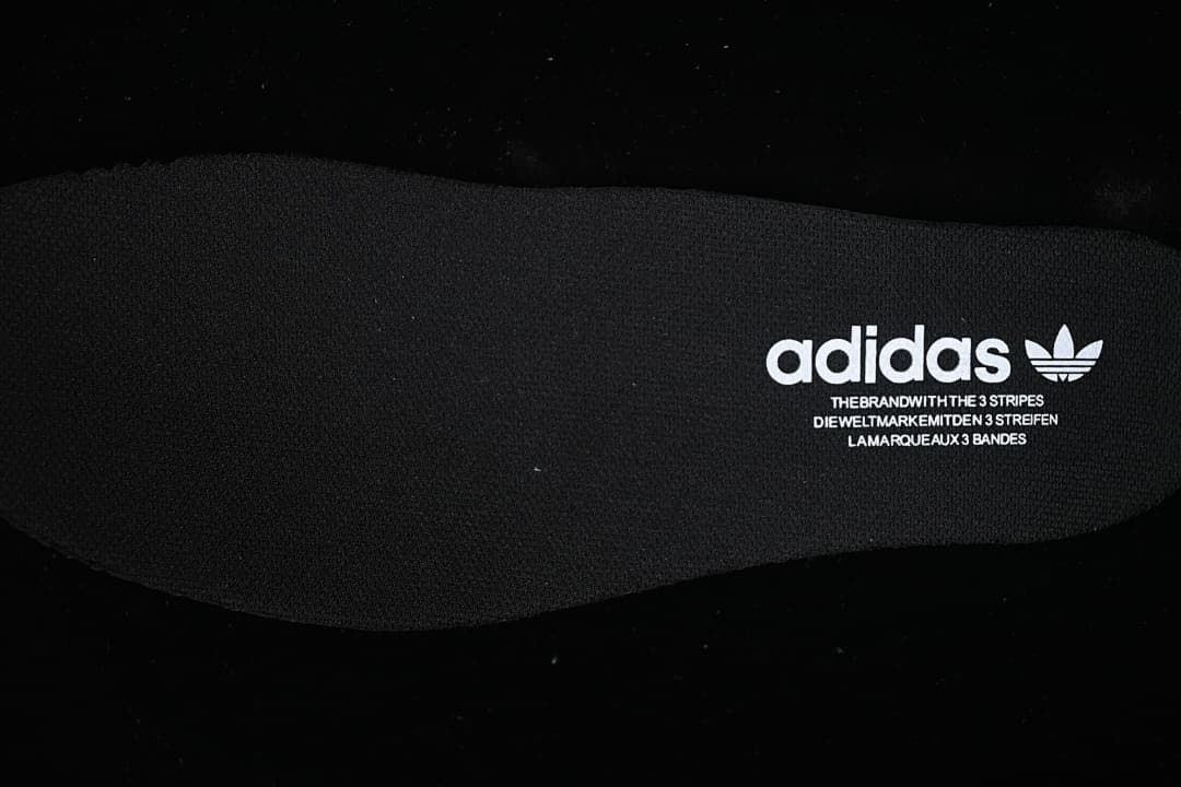 Black insole with adidas Trefoil branding