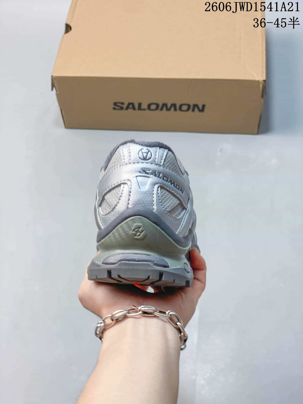 Rear view of the silver and gray Salomon sneaker.