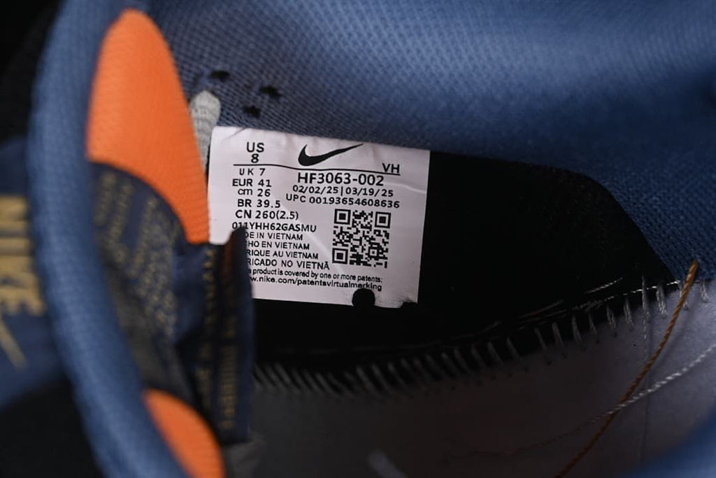 Close-up of the shoe label showing style code HF3063-002 and size markings