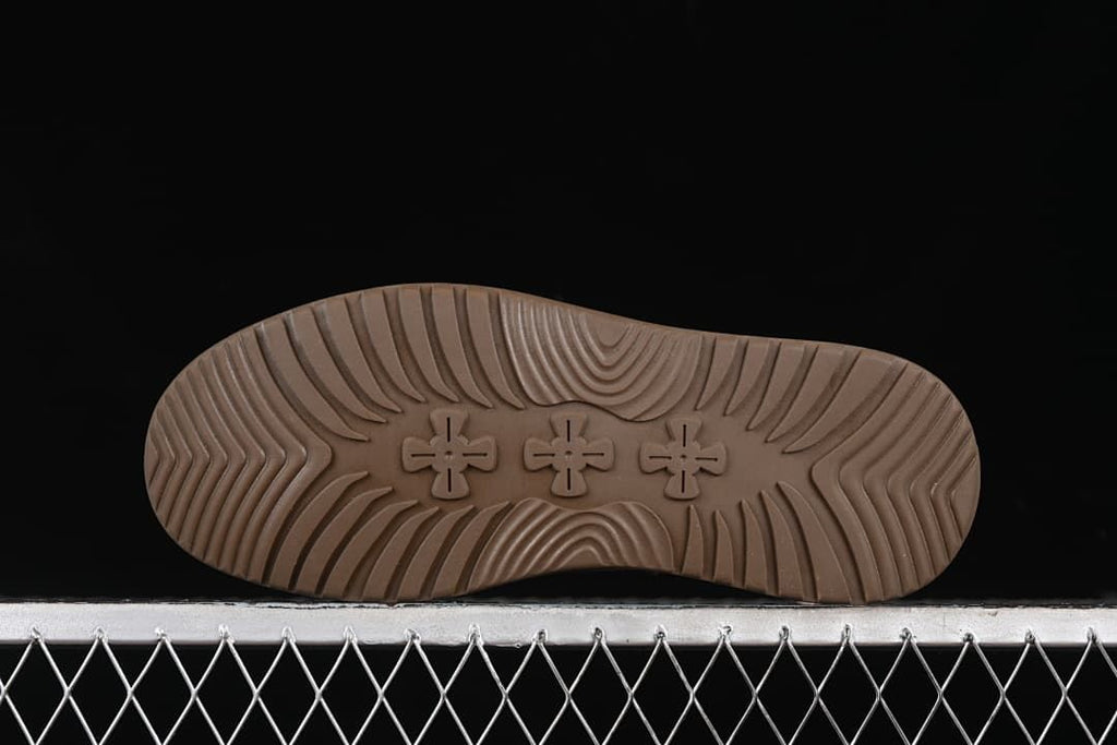 Underside view showing the boot sole tread pattern