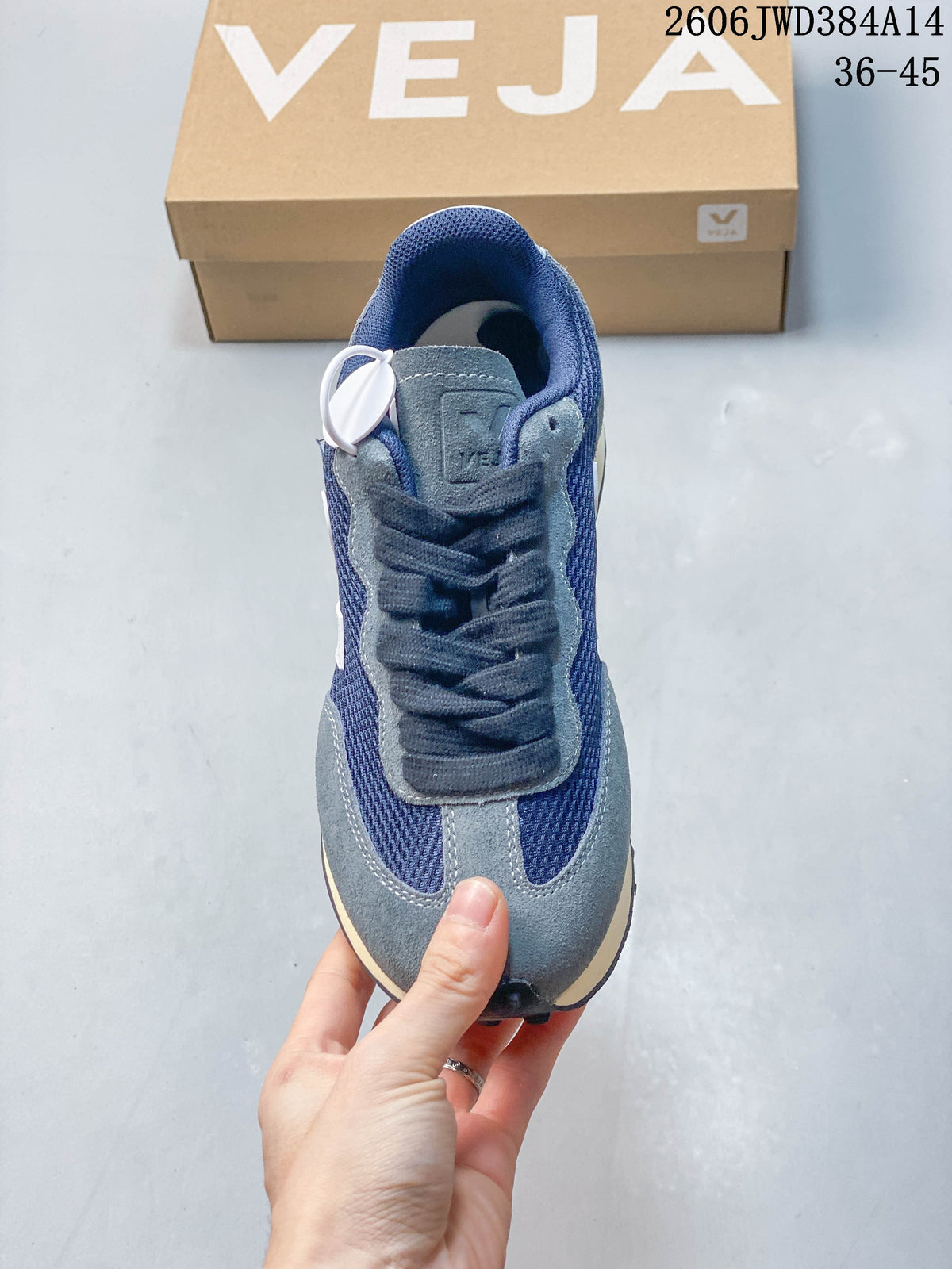 Top view showing the laces and navy, grey and white panels