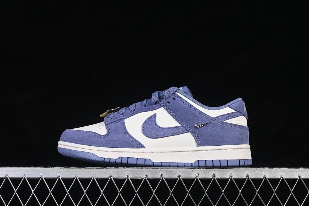 Side view of a blue and white Nike SB Dunk Low sneaker