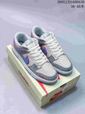 Pair of light grey and off-white Nike SB Dunk Low sneakers with blue and red accents, shown with a shoe box