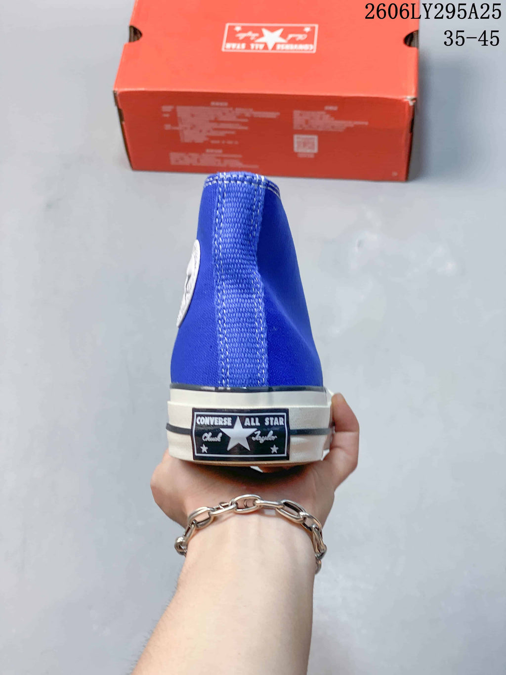 Rear view showing the heel label and striped sole edge