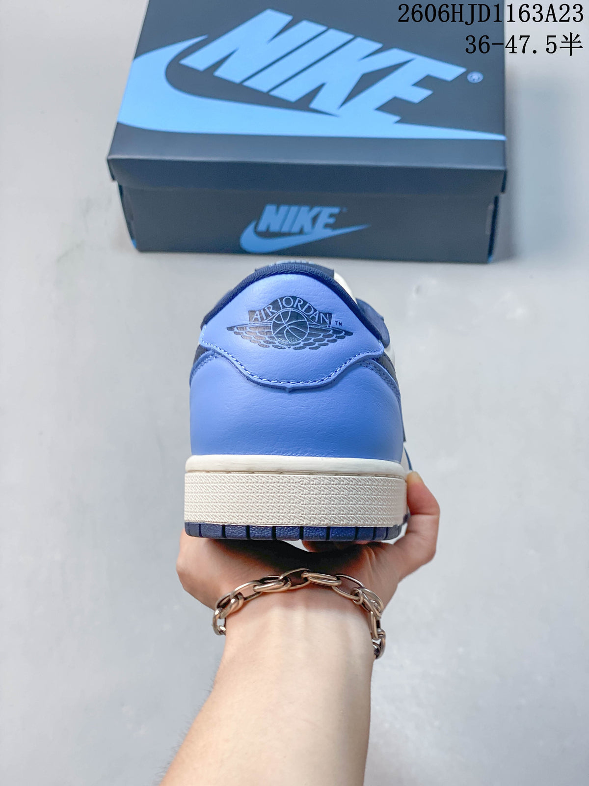 Rear view showing the blue heel and Air Jordan Wings logo