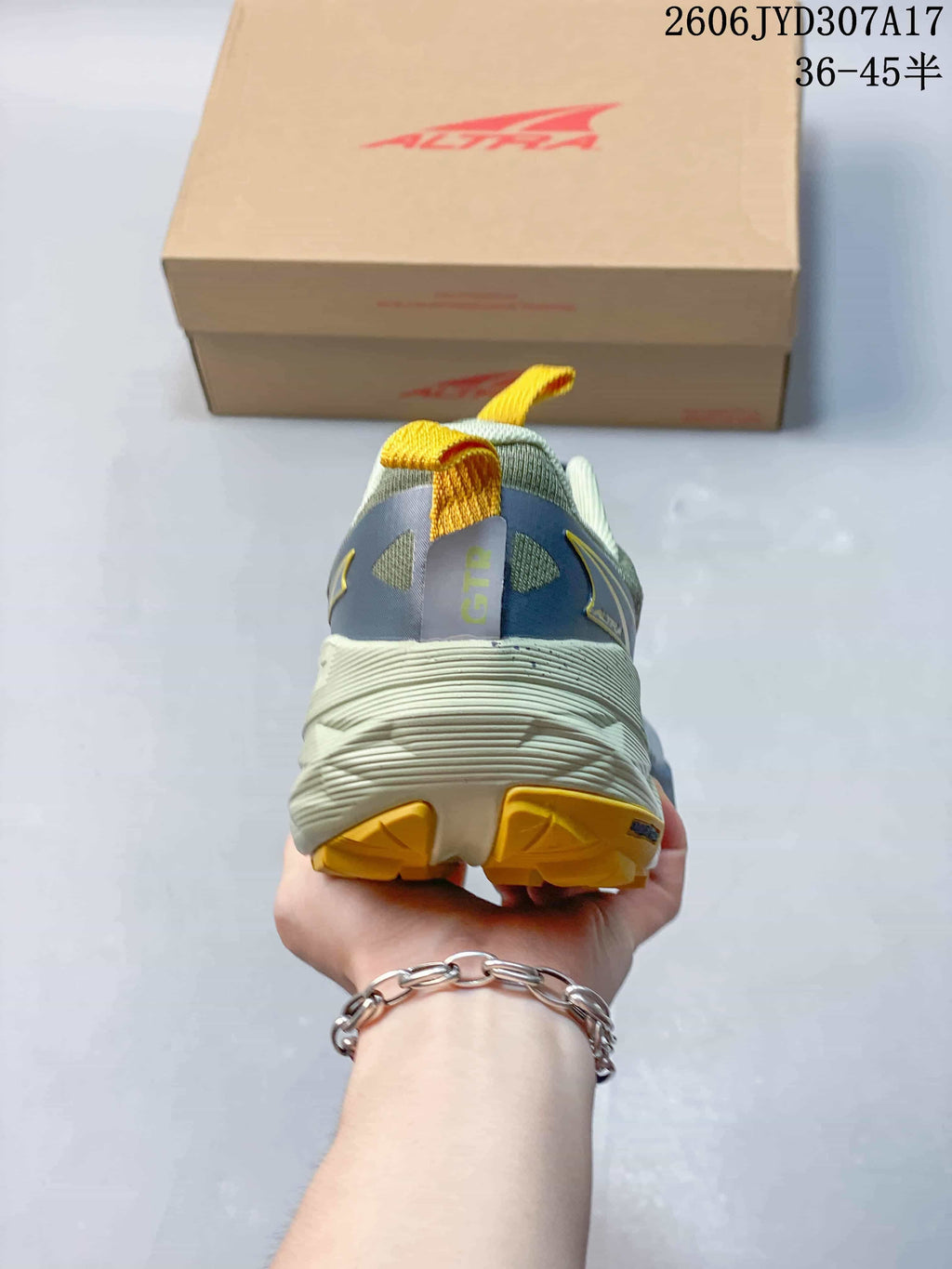 Rear view of the running shoe showing the heel and outsole.