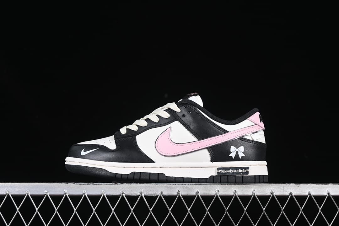 Side view highlighting the pink Swoosh and bow accent