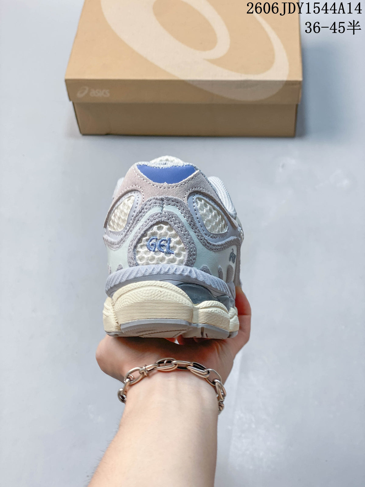 Rear view of a sneaker showing mesh panels, layered overlays, and blue heel detail.