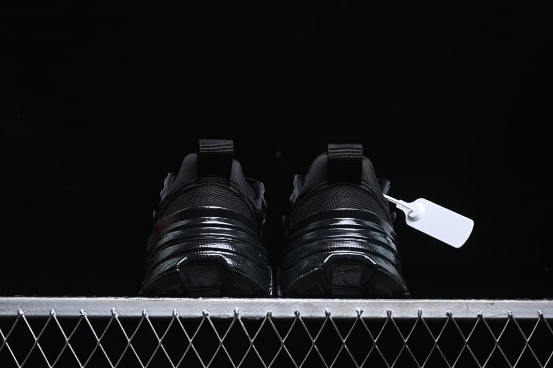 Rear view of the pair showing heel pull tabs and sculpted soles