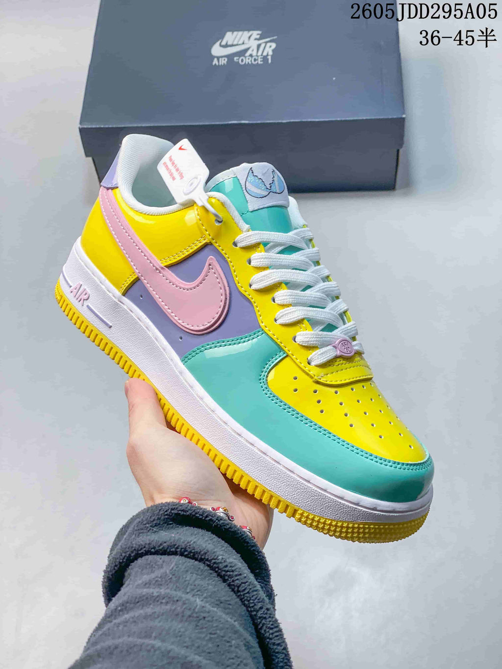 Colorful Nike Air Force 1 low-top sneaker in yellow, pink, lavender, and teal