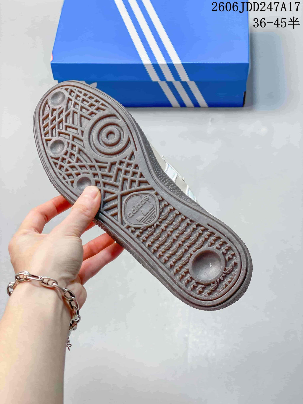 Close-up of the patterned outsole on a cream adidas Handball Spezial shoe