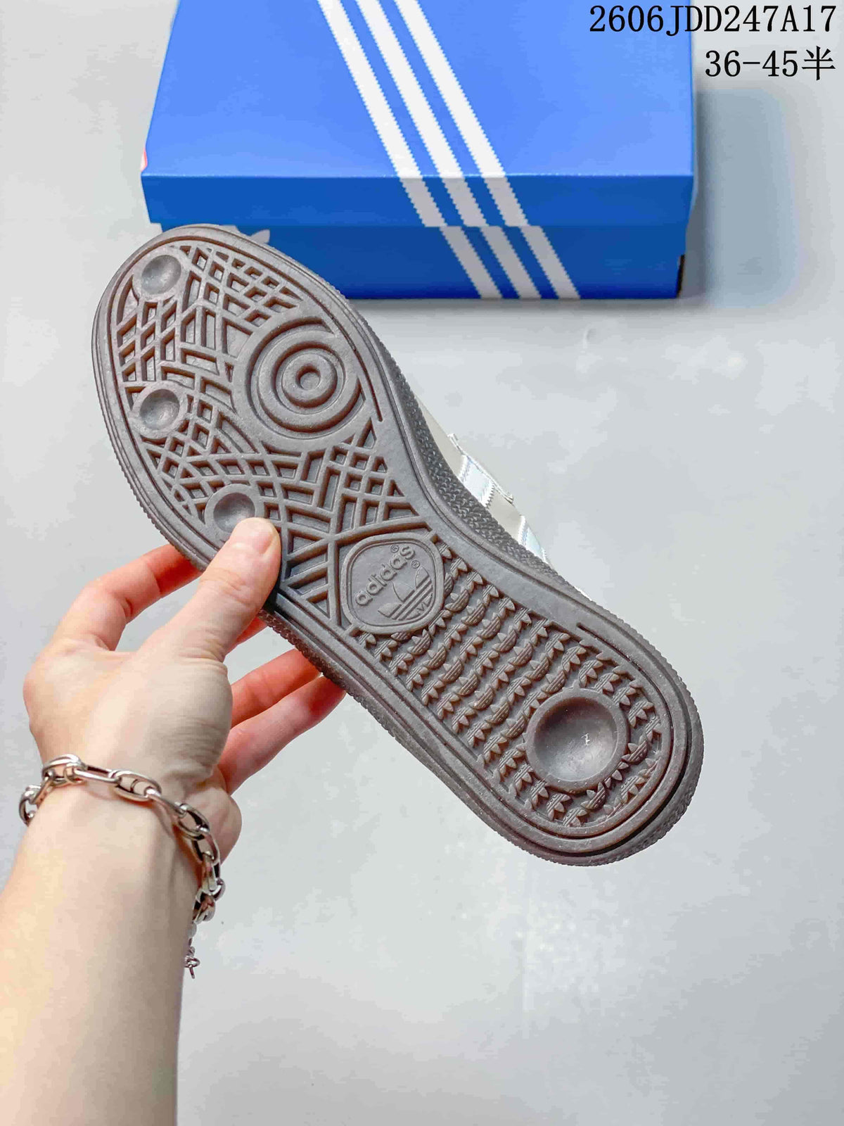 Close-up of the patterned outsole on a cream adidas Handball Spezial shoe