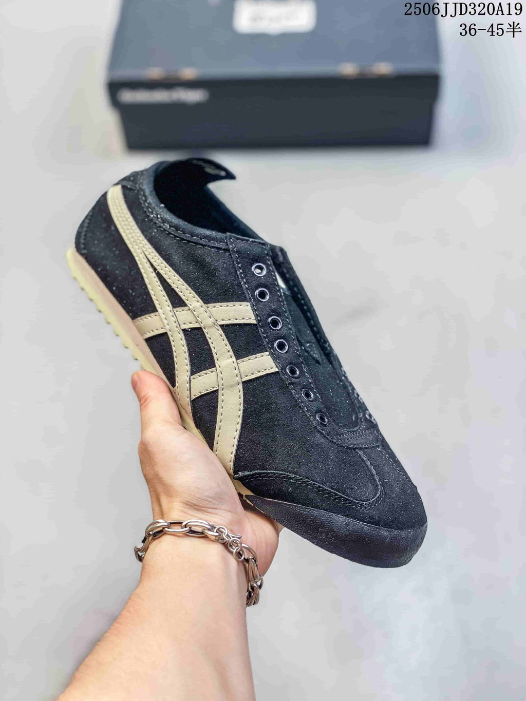 Black low-top sneaker with beige side stripes and a light outsole