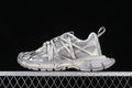 Side view of a silver and grey Balenciaga 3XL sneaker against a dark background