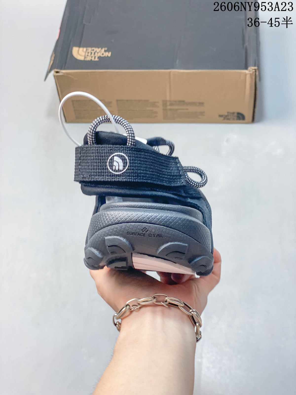 Rear view of the sandal showing the heel strap and outsole.