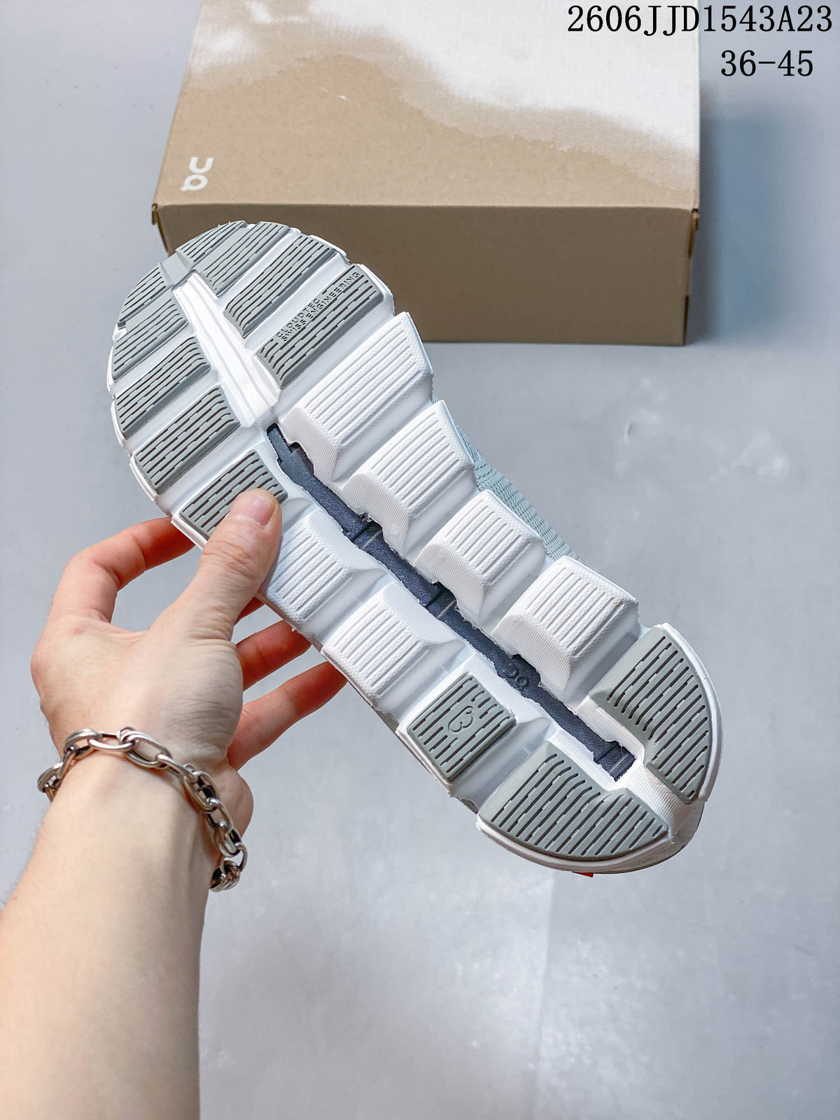 Underside of an On Cloudtilt Remix sneaker showing its segmented outsole