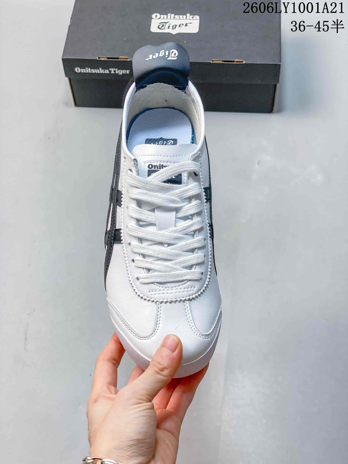 Top view of a white lace-up Onitsuka Tiger sneaker with navy details