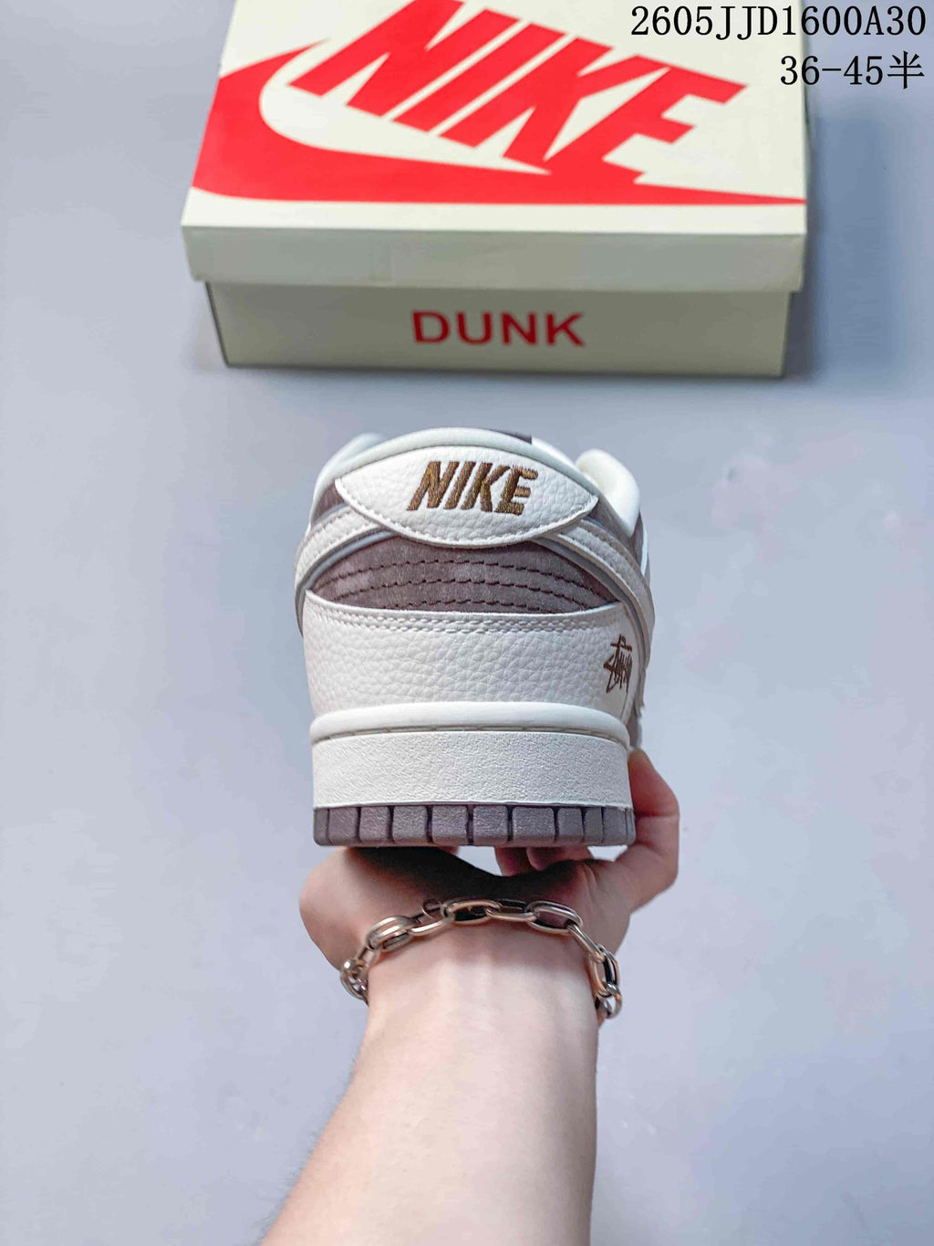 Rear view of the low-top sneaker showing heel panels and outsole