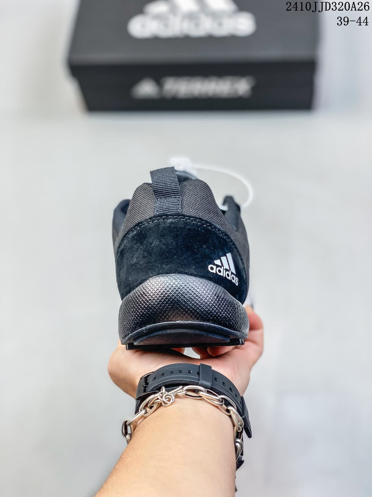 Rear view of the charcoal adidas Daroga Plus shoe.