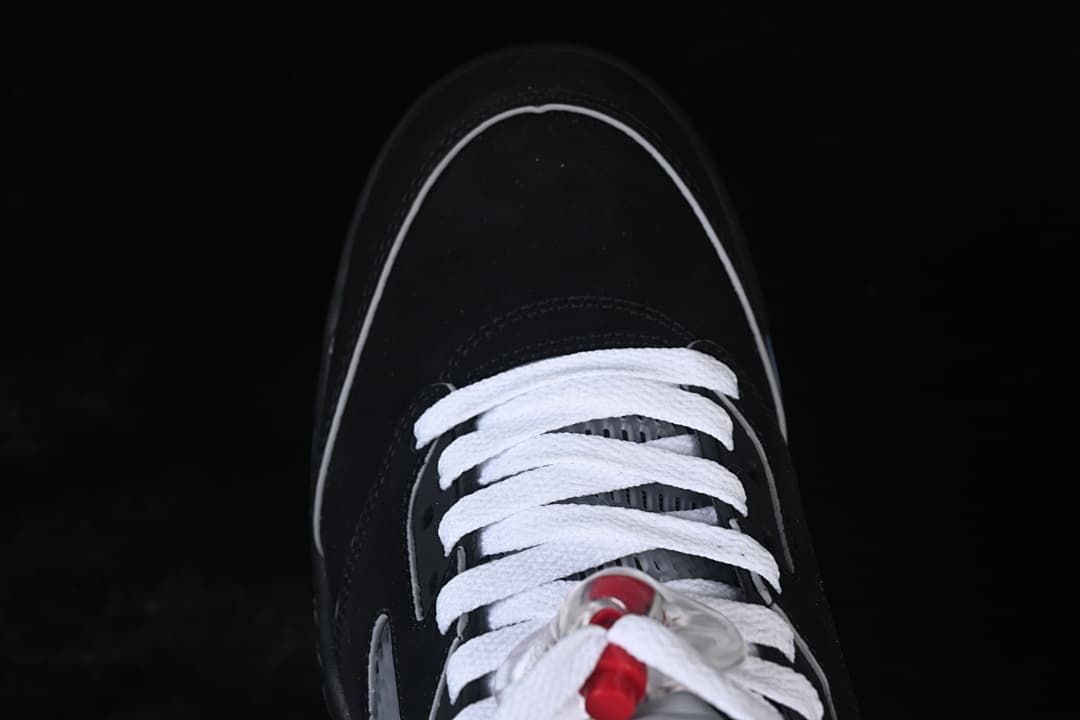 Top view of the sneaker toe and white laces