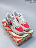 Pair of white, red, and blue low-top sneakers with embroidered heel panels, shown on a matching box.