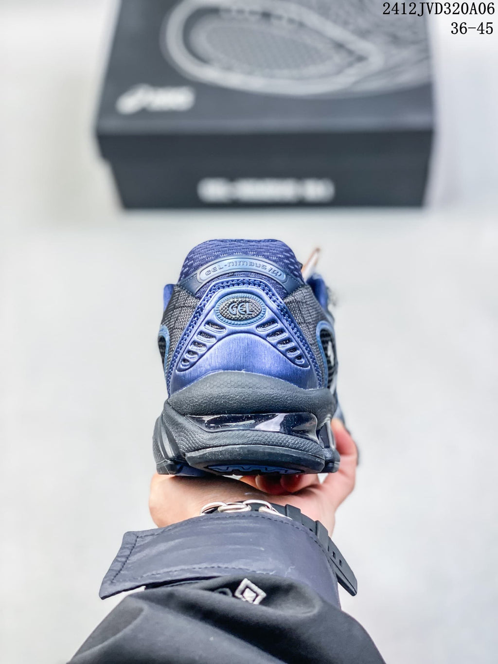 Rear view of a blue and black sneaker with a sculpted heel.