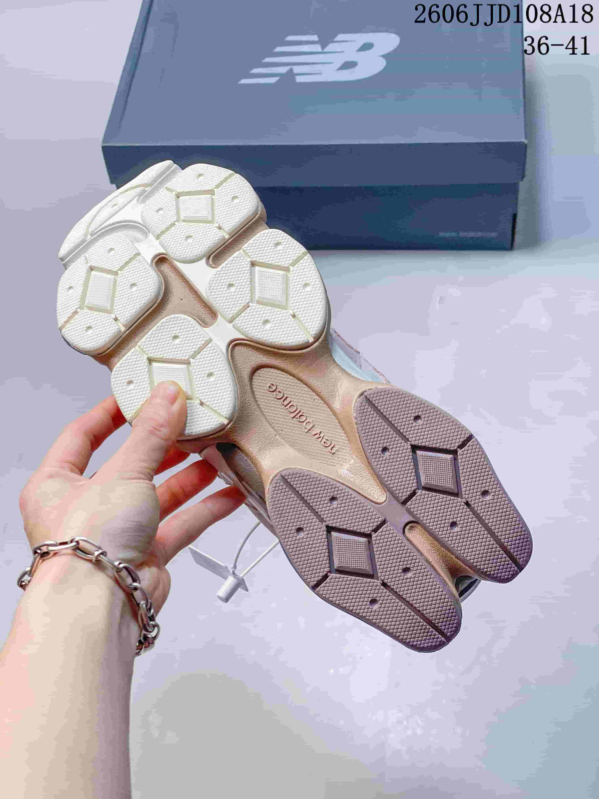 Outsole view of a New Balance 9060 sneaker showing segmented tread