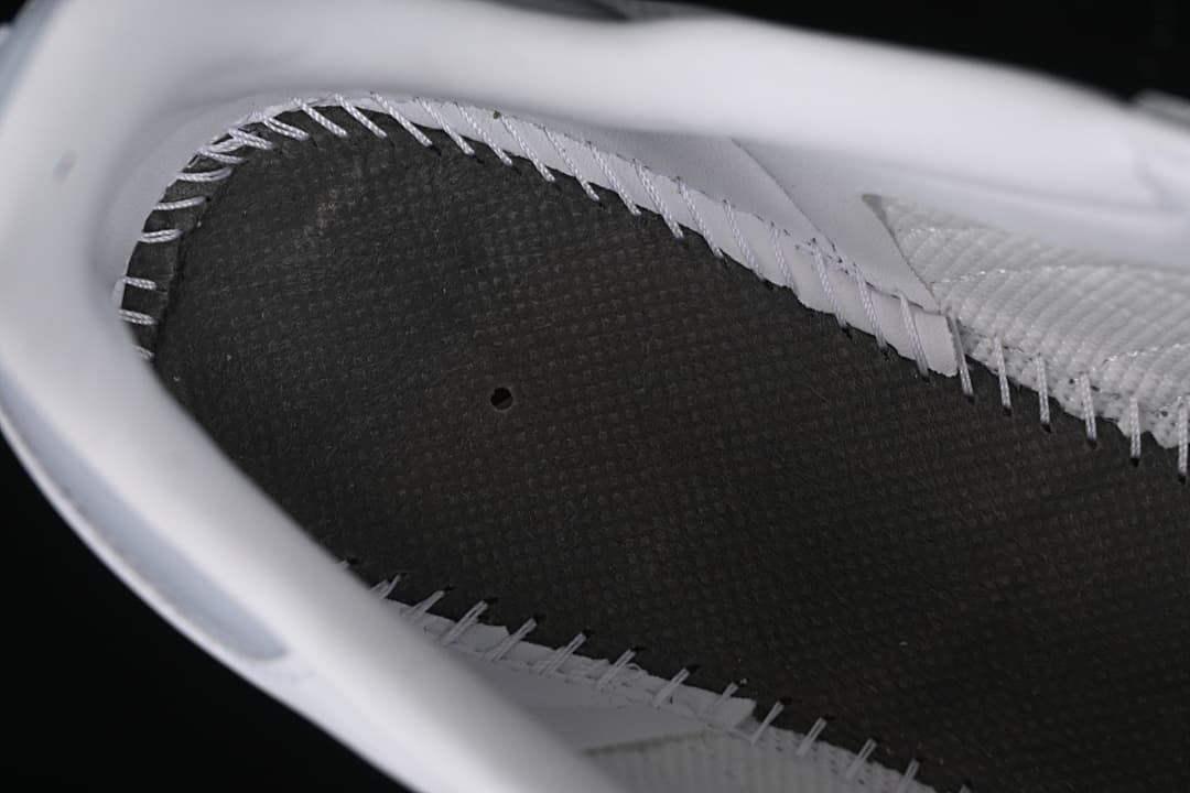 Close-up view inside the sneaker showing stitching and lining