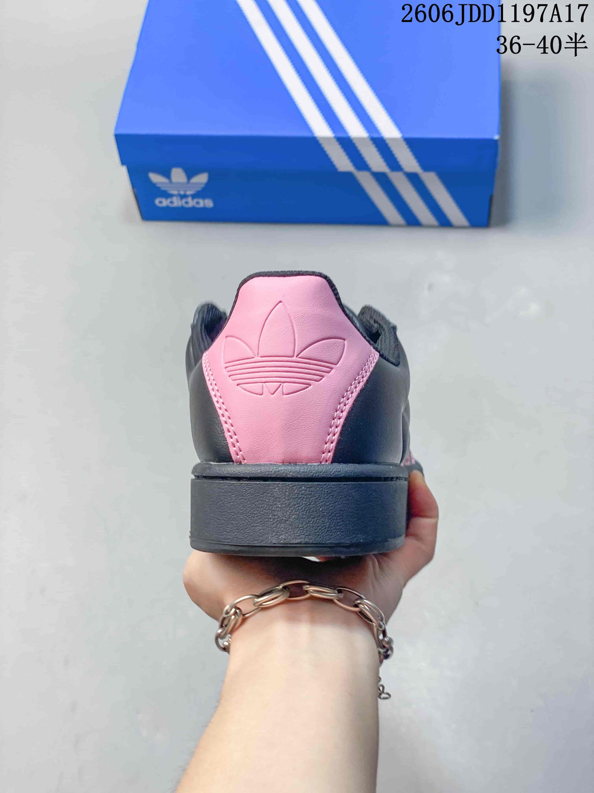 Rear view of a dark sneaker with a pink heel tab.