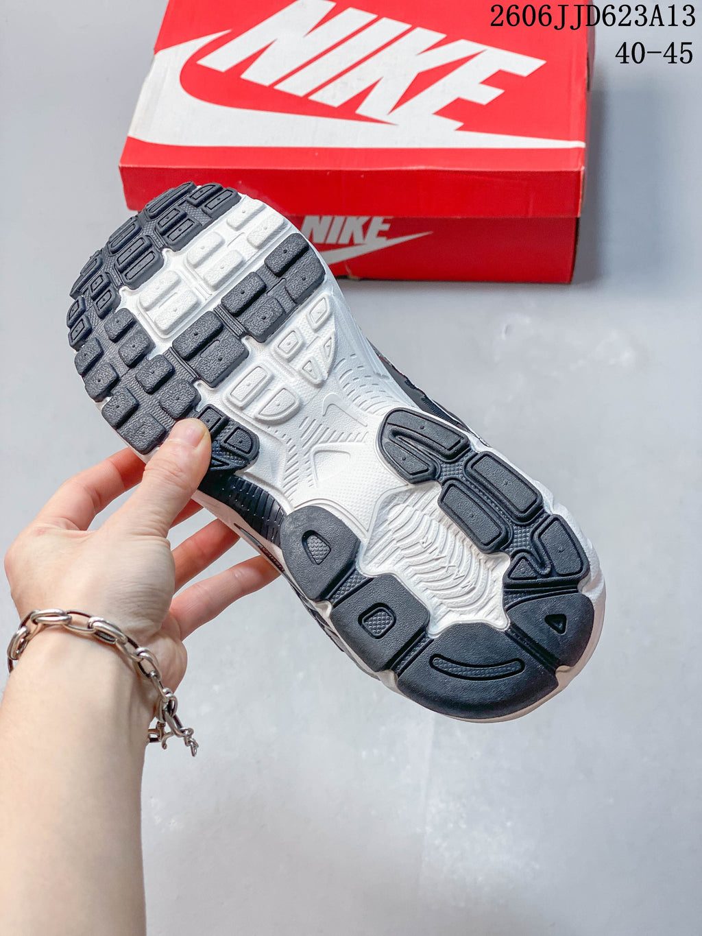 Close-up of the patterned outsole on a Nike Air Max Moto 2K sneaker