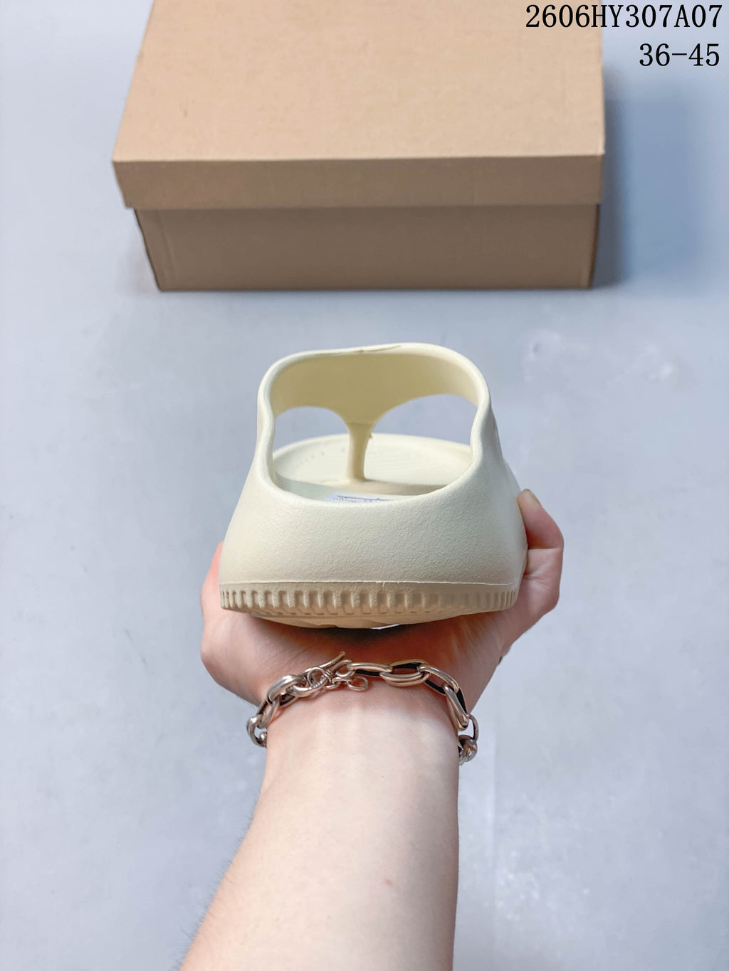Rear view of the pale cream sandal