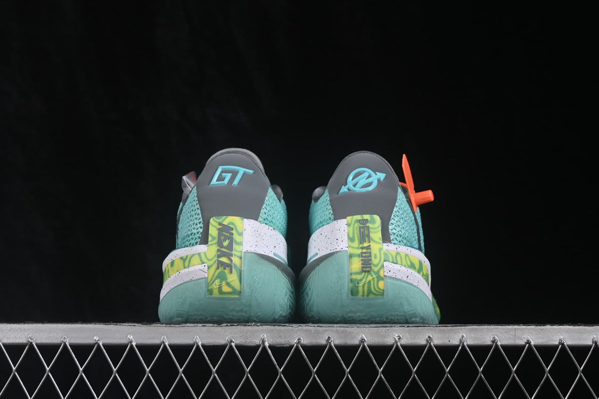 Rear view of the pair showing gray heel panels, GT branding, lime graphic heel details, and translucent soles.