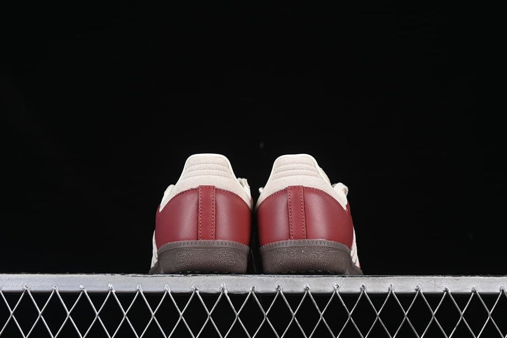 Rear view showing burgundy heel panels and cream heel overlays