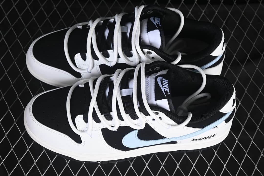 Pair of black, white, and light blue low-top sneakers viewed from above